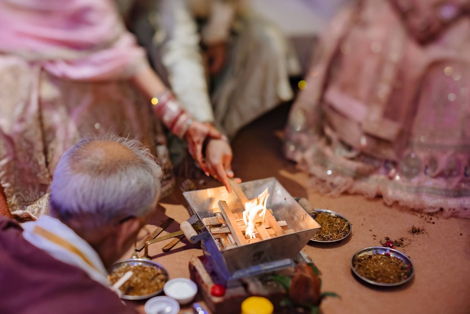 Shorye and Leah performing their wedding pheras indoors at Tivoli Chattarpur