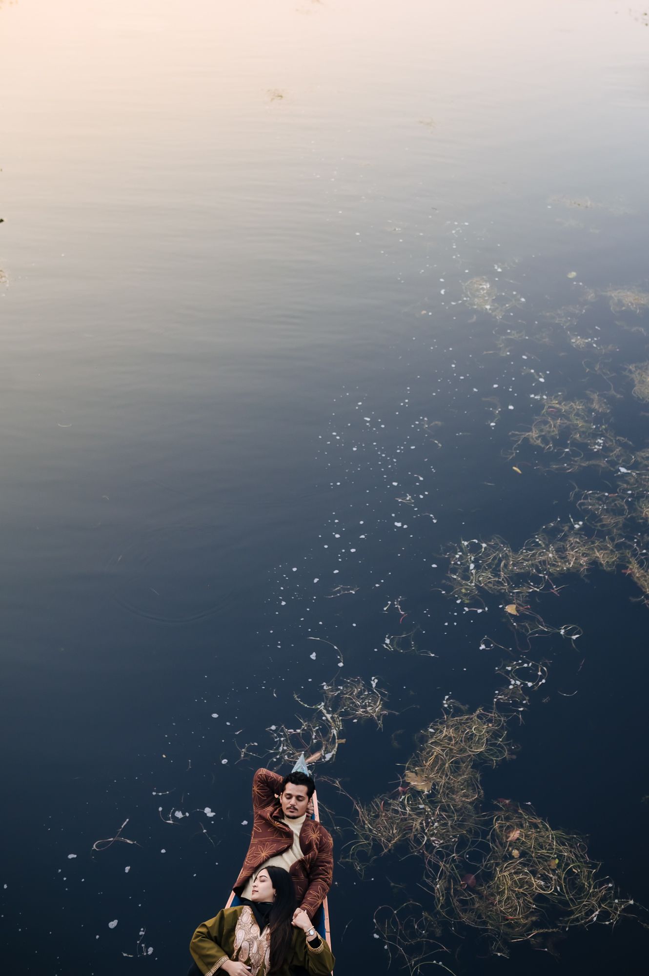Dreamy pre-wedding couple photography with picturesque Srinagar Dal Lake valley backdrop