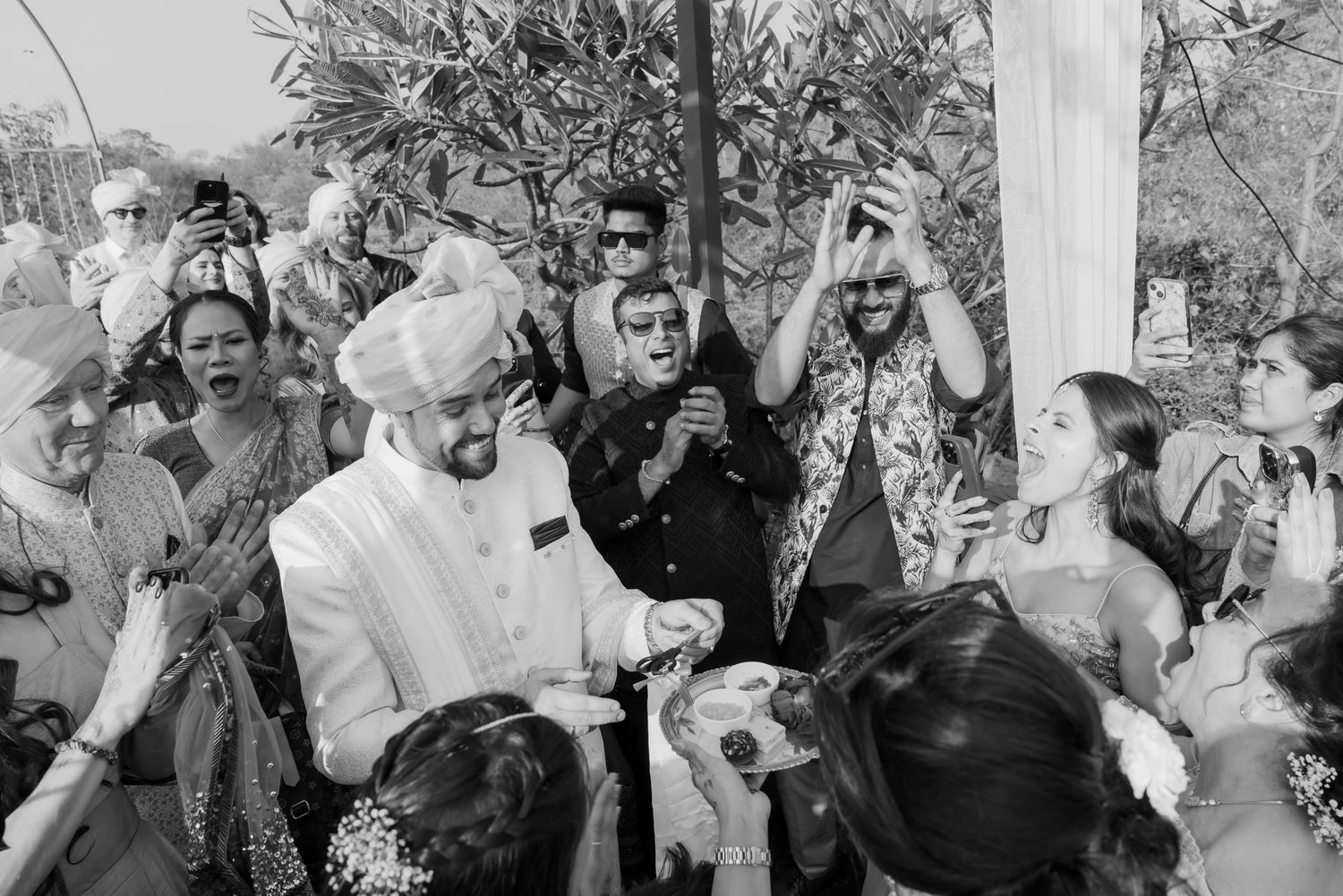 Joyful baraat with the groom's Norwegian family celebrating in Indian attire for an Indo-Norwegian fusion wedding in Forest Hill Chandigarh