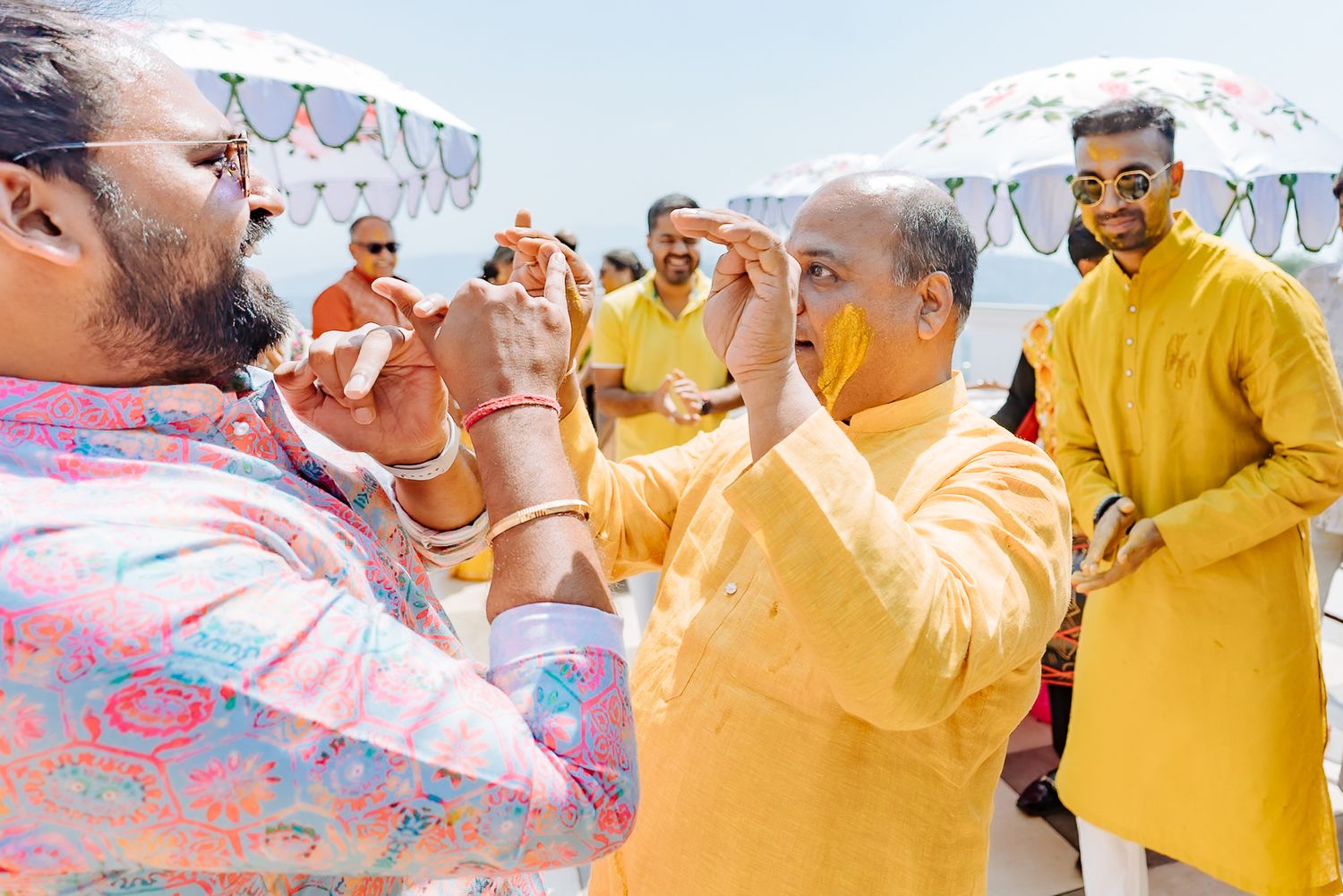 Colorful and candid Haldi moments captured by Fine-art and candid Indian wedding photography and films team Beginnings For You.