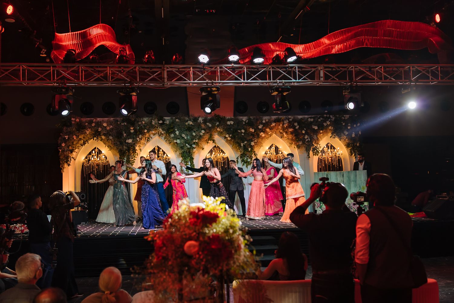 Friends performing an energetic dance for Shorye and Leah at Tivoli Chattarpur