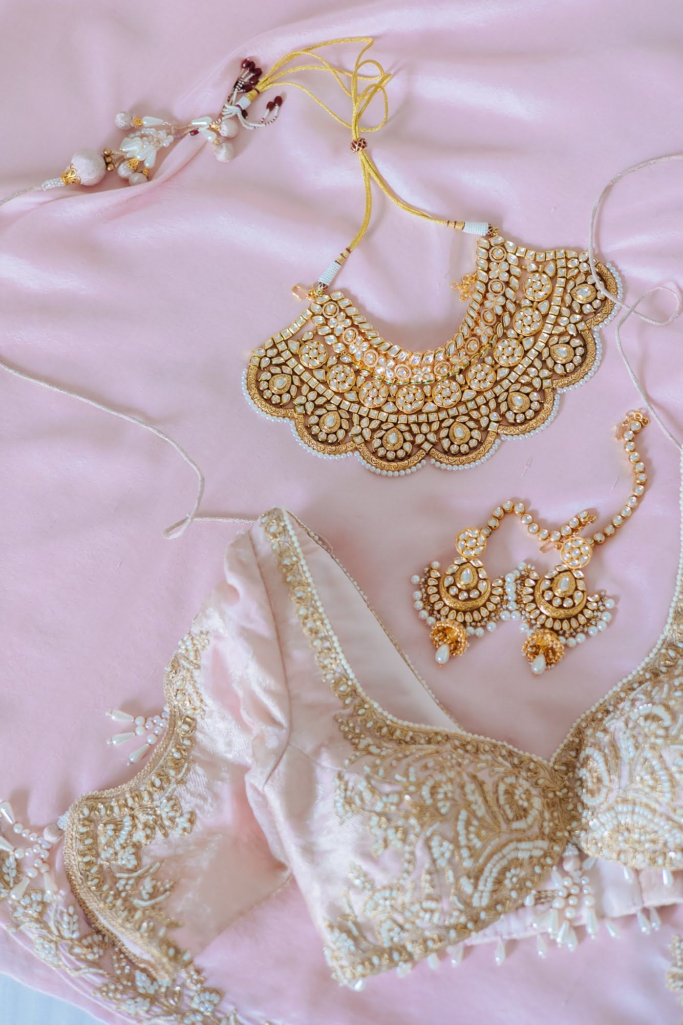 Leah dressed in a pastel pink bridal outfit for her Indian wedding at Tivoli Chattarpur