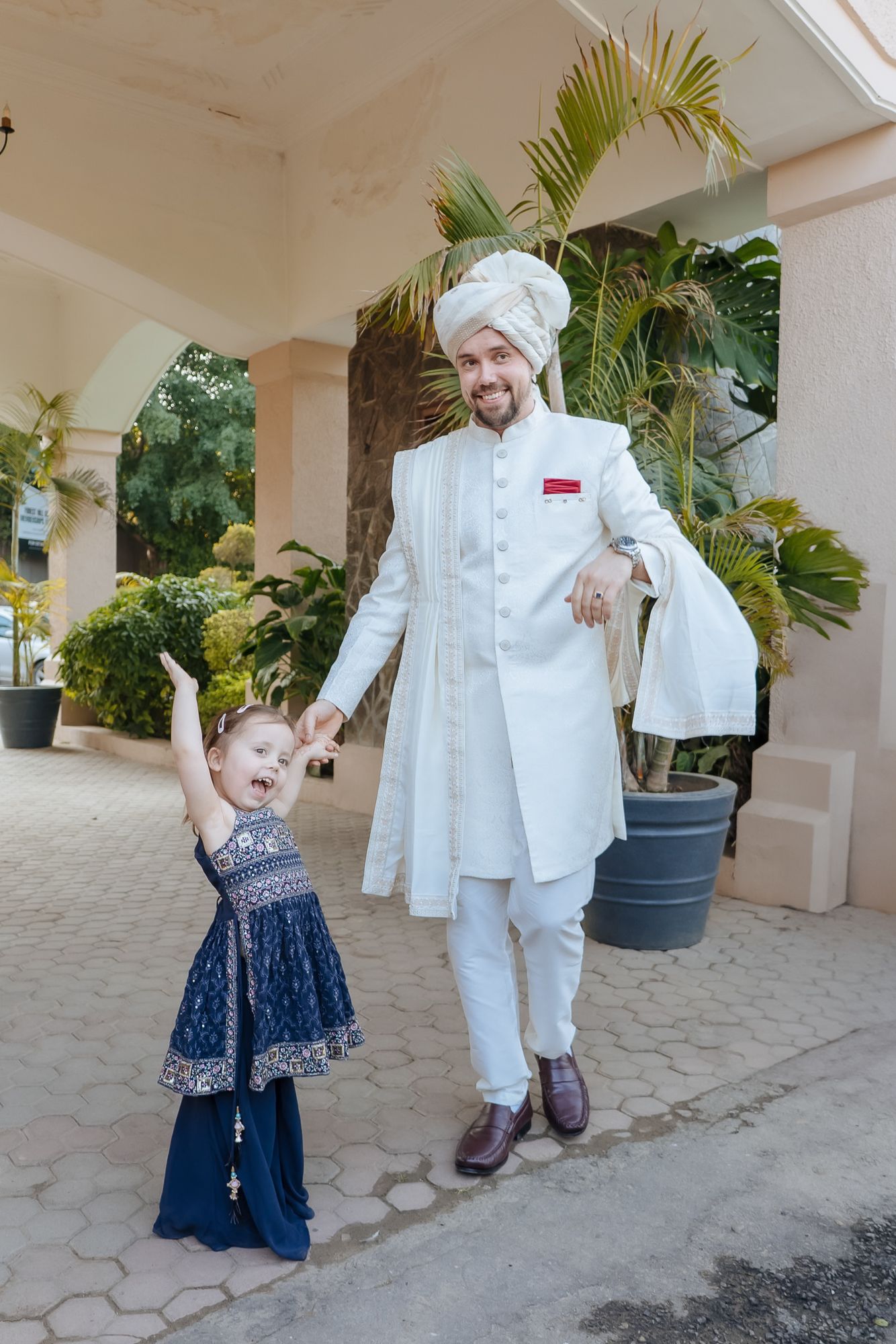 Joyful baraat with the groom's Norwegian family celebrating in Indian attire for an Indo-Norwegian fusion wedding in Forest Hill Chandigarh