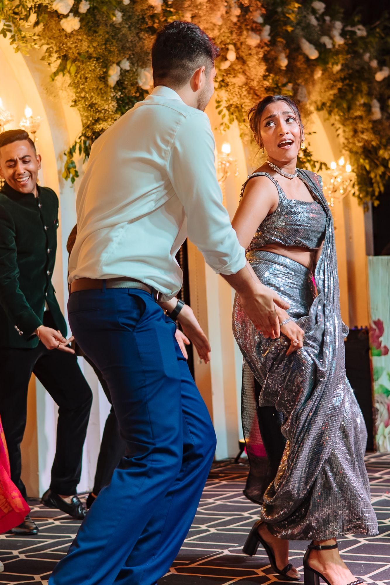 Friends performing an energetic dance for Shorye and Leah at Tivoli Chattarpur