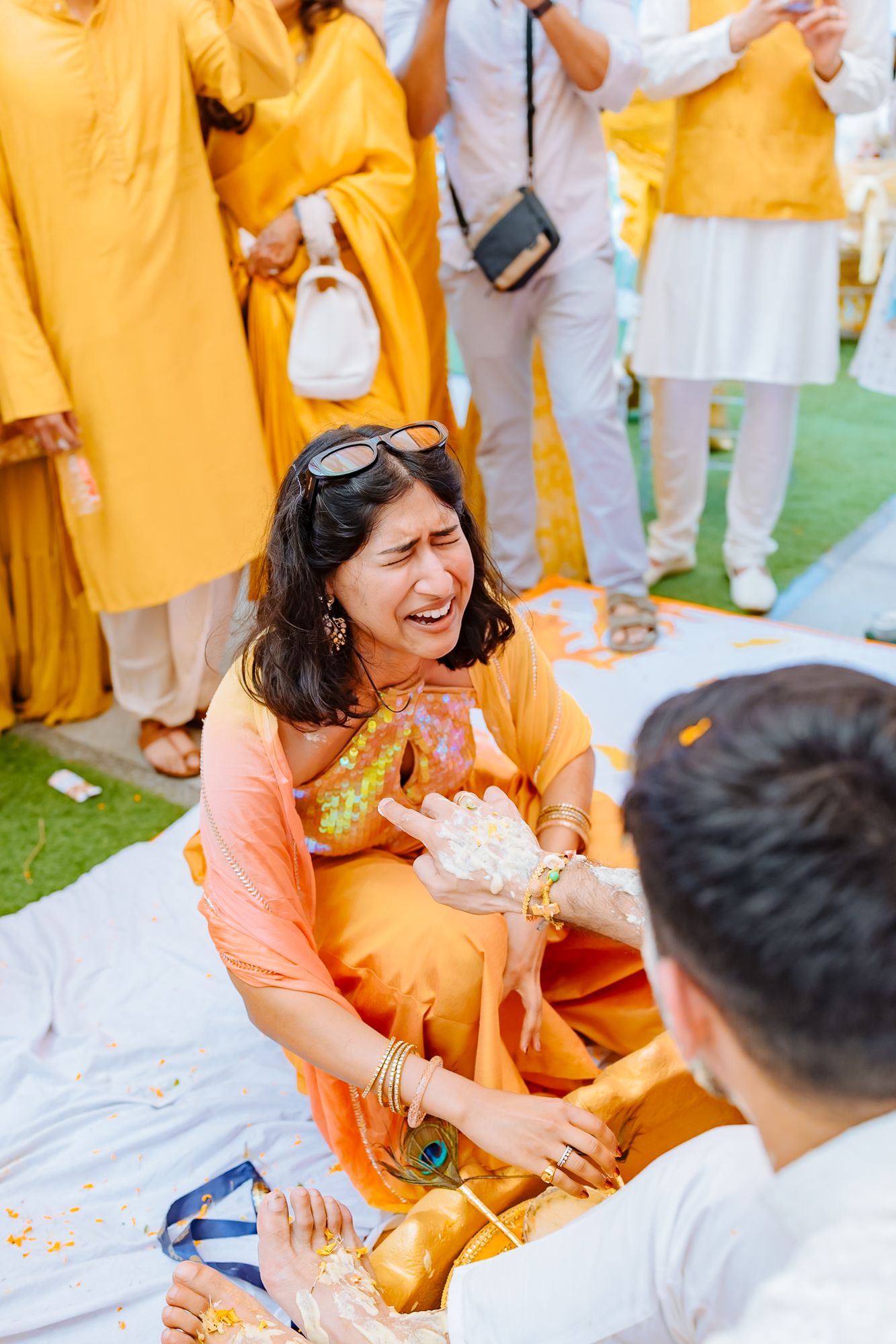 Shorye and Leah sharing a candid Haldi moment with their wedding guests at Tivoli Chattarpur
