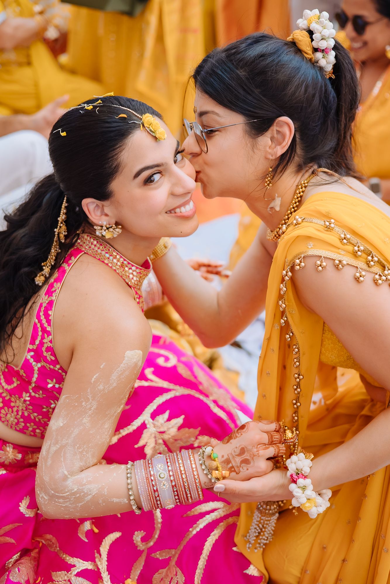 Wedding guests applying haldi and blessing Shorye and Leah at Tivoli Chattarpur