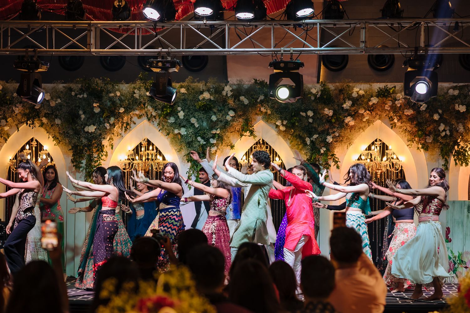 An energetic group dance bringing the Sangeet celebration to life at Tivoli Chattarpur