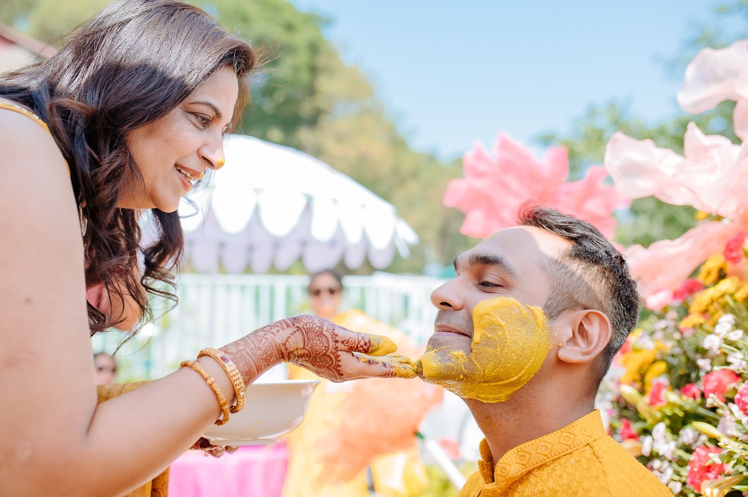 Colorful and candid Haldi moments captured by Fine-art and candid Indian wedding photography and films team Beginnings For You.