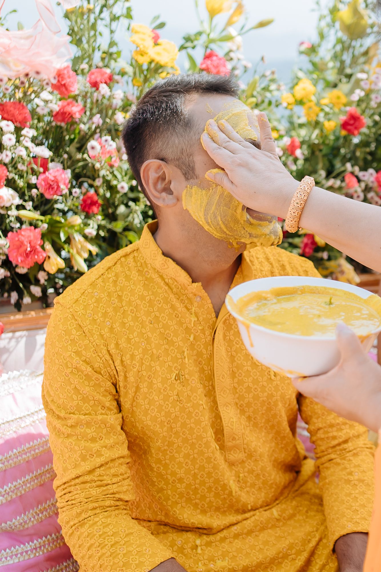 Haldi ceremony close-up and Fine-art and candid wedding storytelling by Beginnings For You.