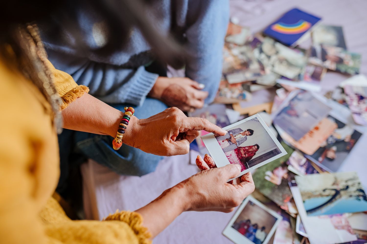 Emotional storytelling wedding photograph of a bride with treasured family memories by Luxury candid wedding photography capturing nostalgia