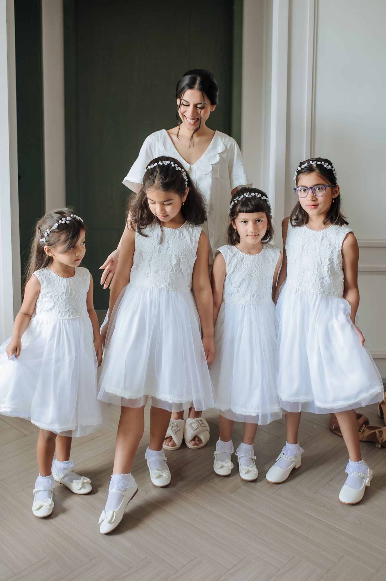 Leah sharing a joyful moment with her bridesmaids before the Christian wedding at Tivoli Chattarpur.