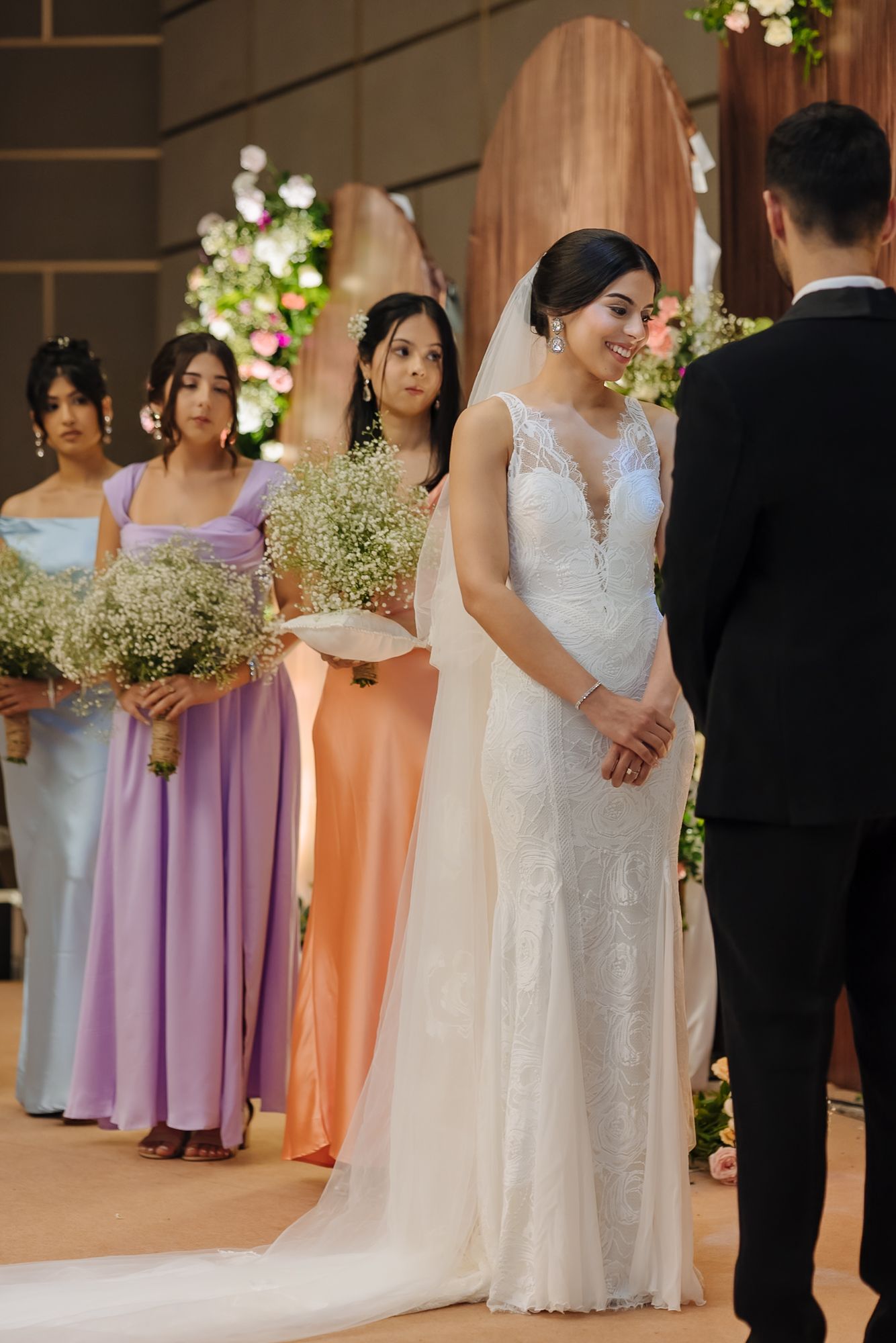 Shorye and Leah exchanging emotional vows during their Christian wedding at Tivoli Chattarpur