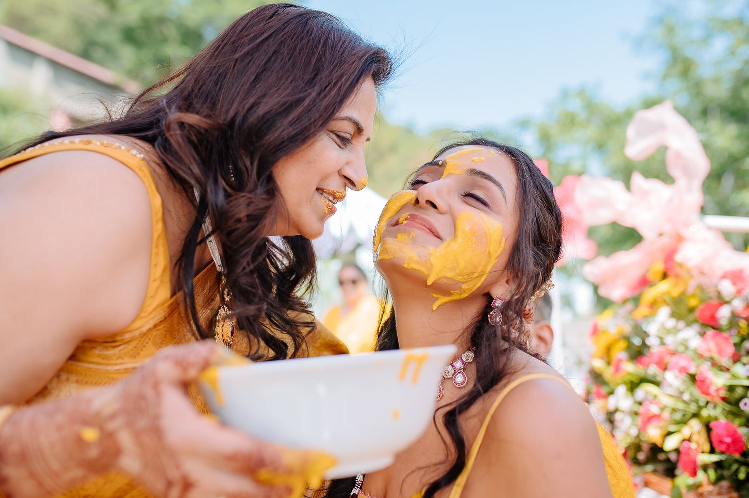 Colorful and candid Haldi moments captured by Fine-art and candid Indian wedding photography and films team Beginnings For You.