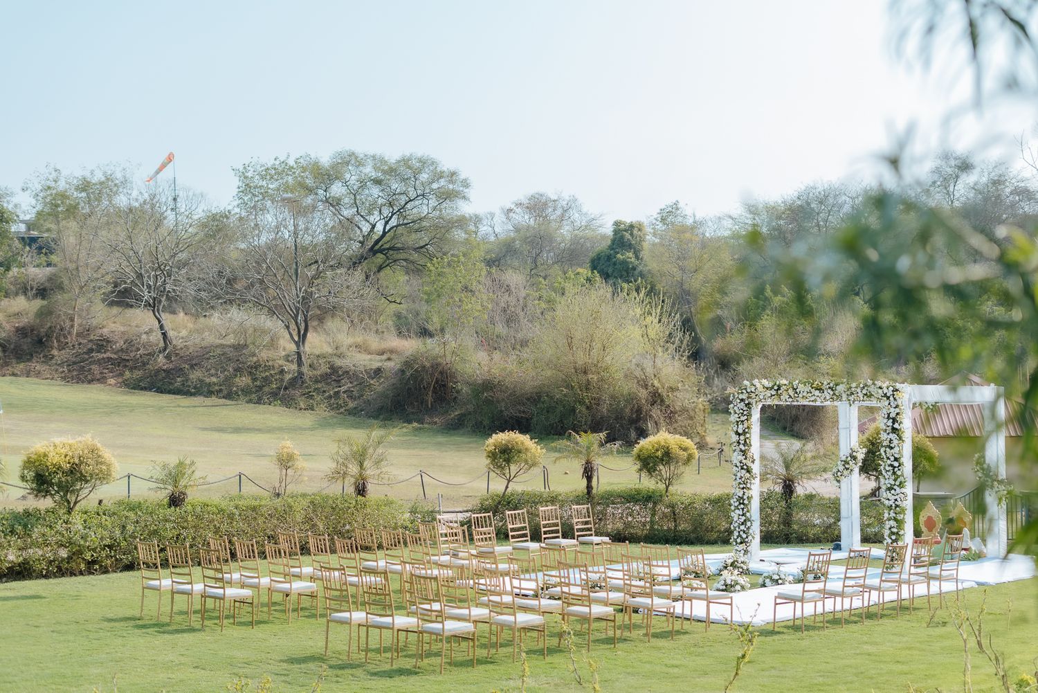 Minimal white floral mandap at Forest Hill for an intimate Indo-Norwegian wedding in Forest Hill, Chandigarh