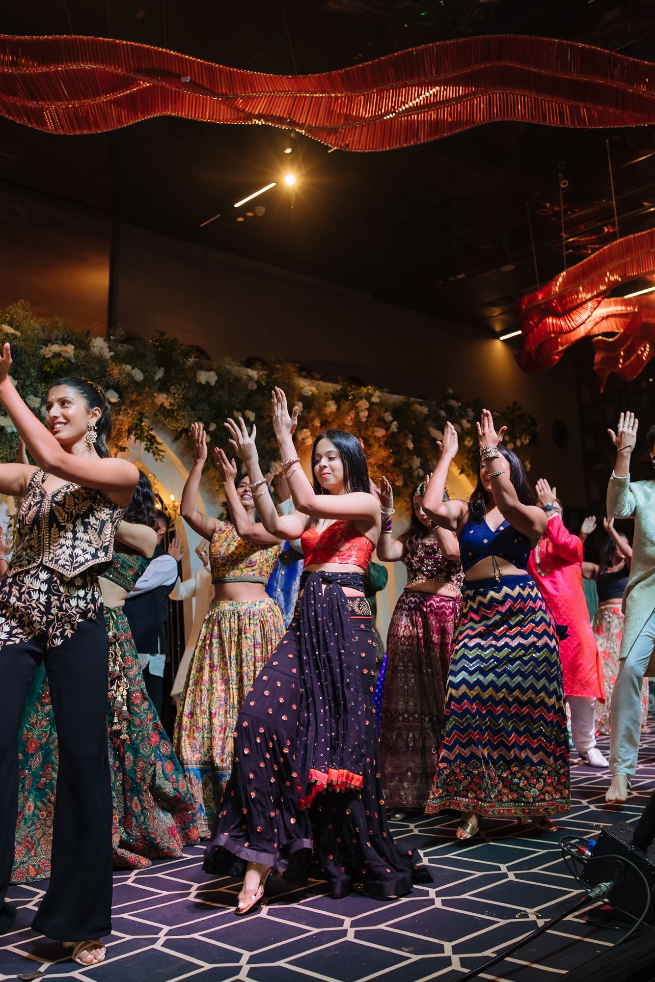 Friends bringing high energy to the Sangeet dance floor at Tivoli Chattarpur