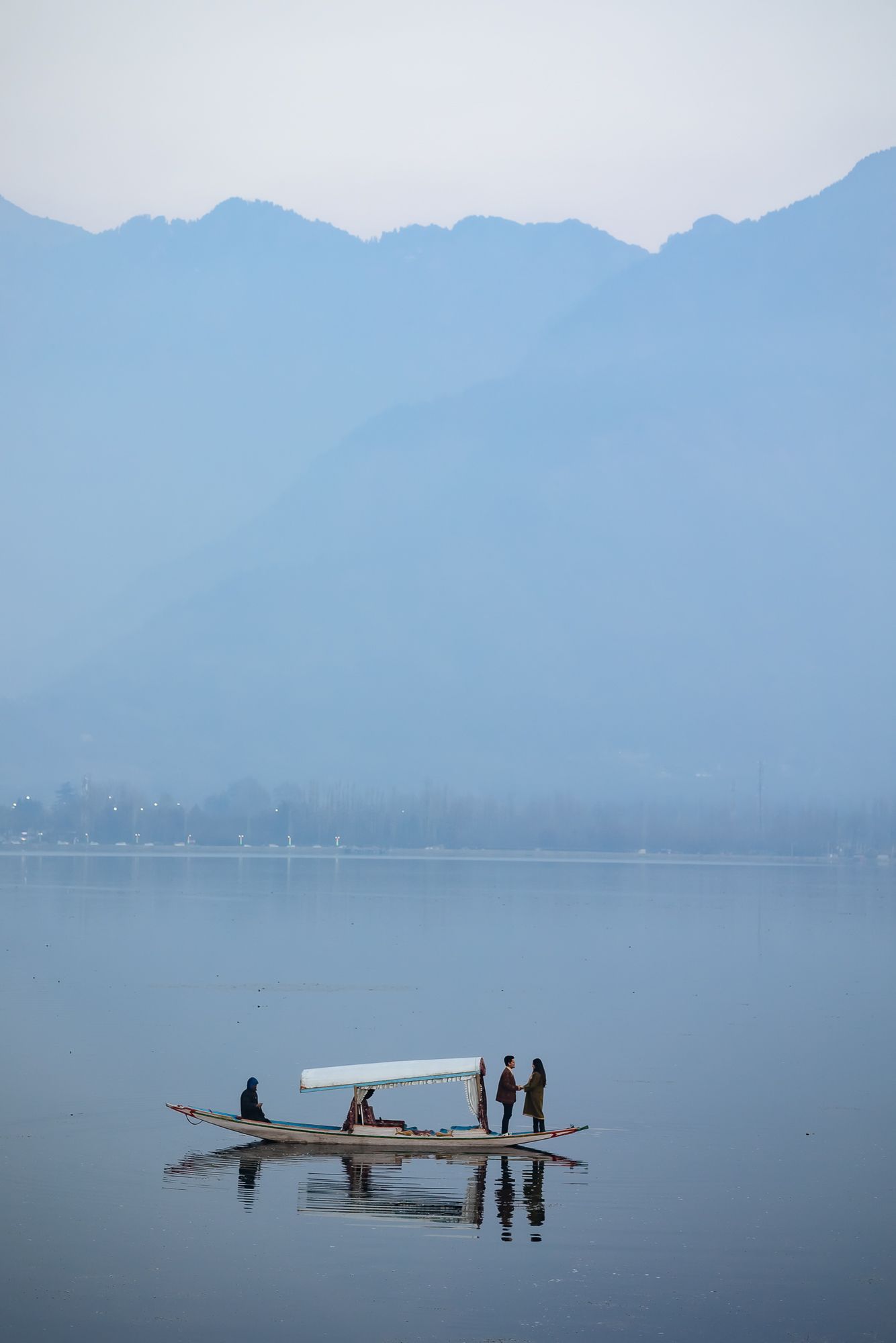 Dreamy pre-wedding couple photography with picturesque Srinagar Dal Lake valley backdrop