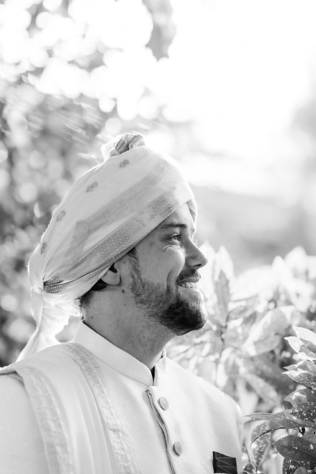 Groom Mats wearing an ivory sherwani before the wedding ceremony for his Indo-Norwegian wedding at Forest Hill, Chandigarh