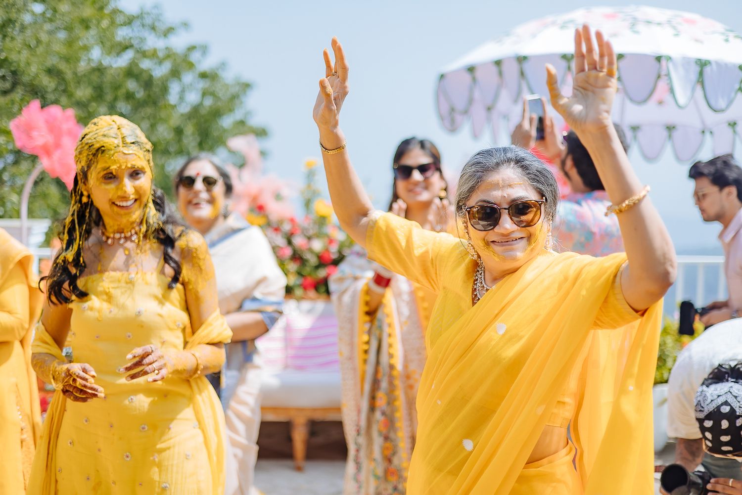 Colorful and candid Haldi moments captured by Fine-art and candid Indian wedding photography and films team Beginnings For You.