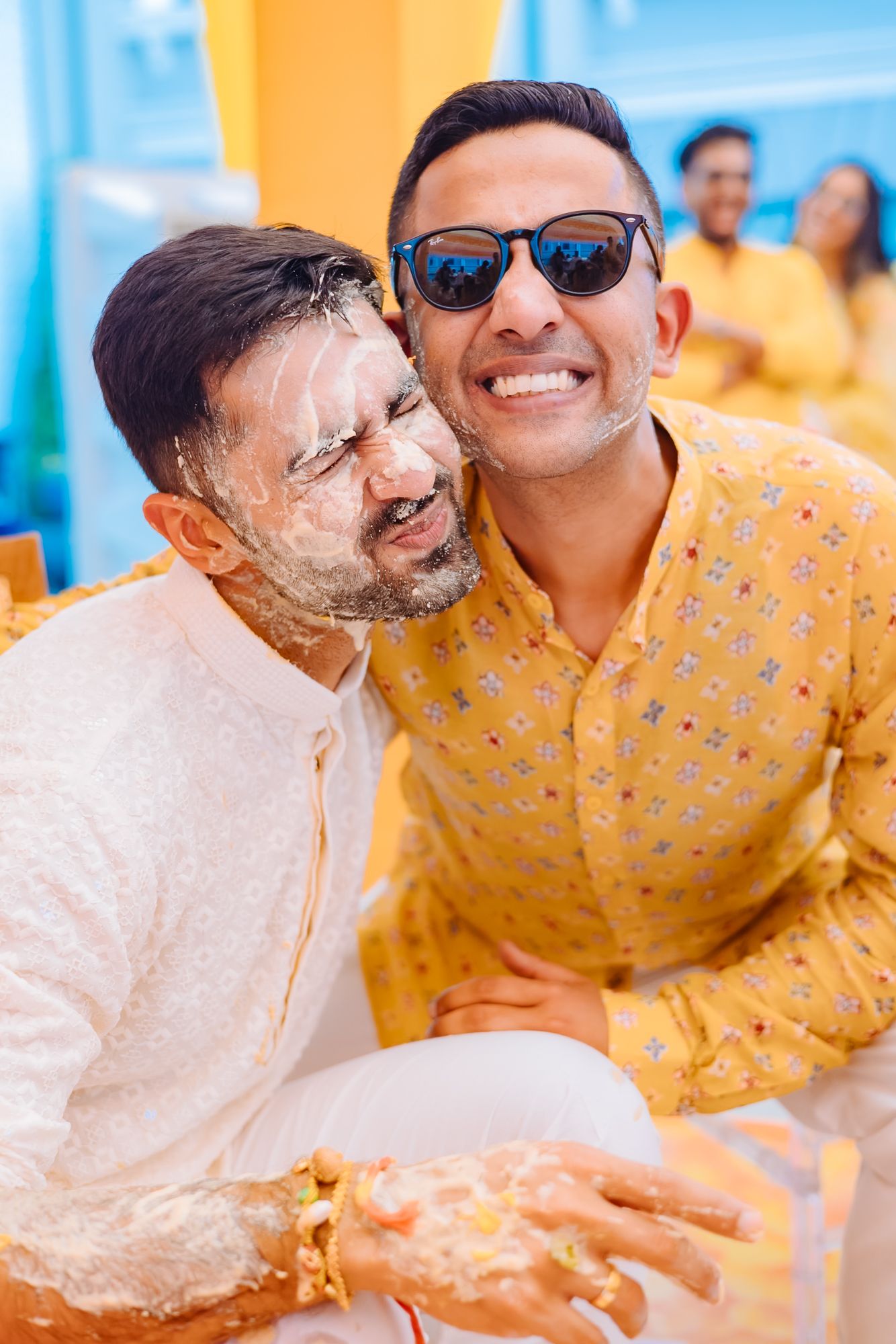 Wedding guests applying haldi and blessing Shorye and Leah at Tivoli Chattarpur