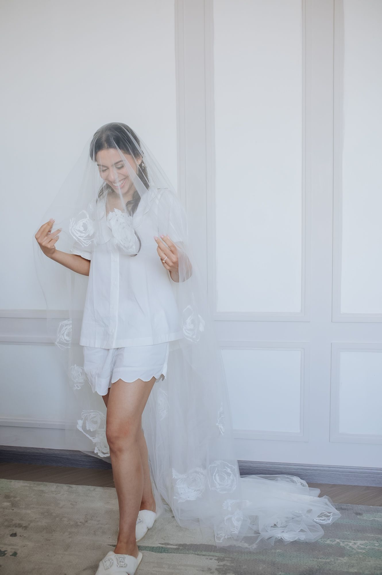 Leah posing in her white wedding dress before the ceremony at Tivoli Chattarpur.