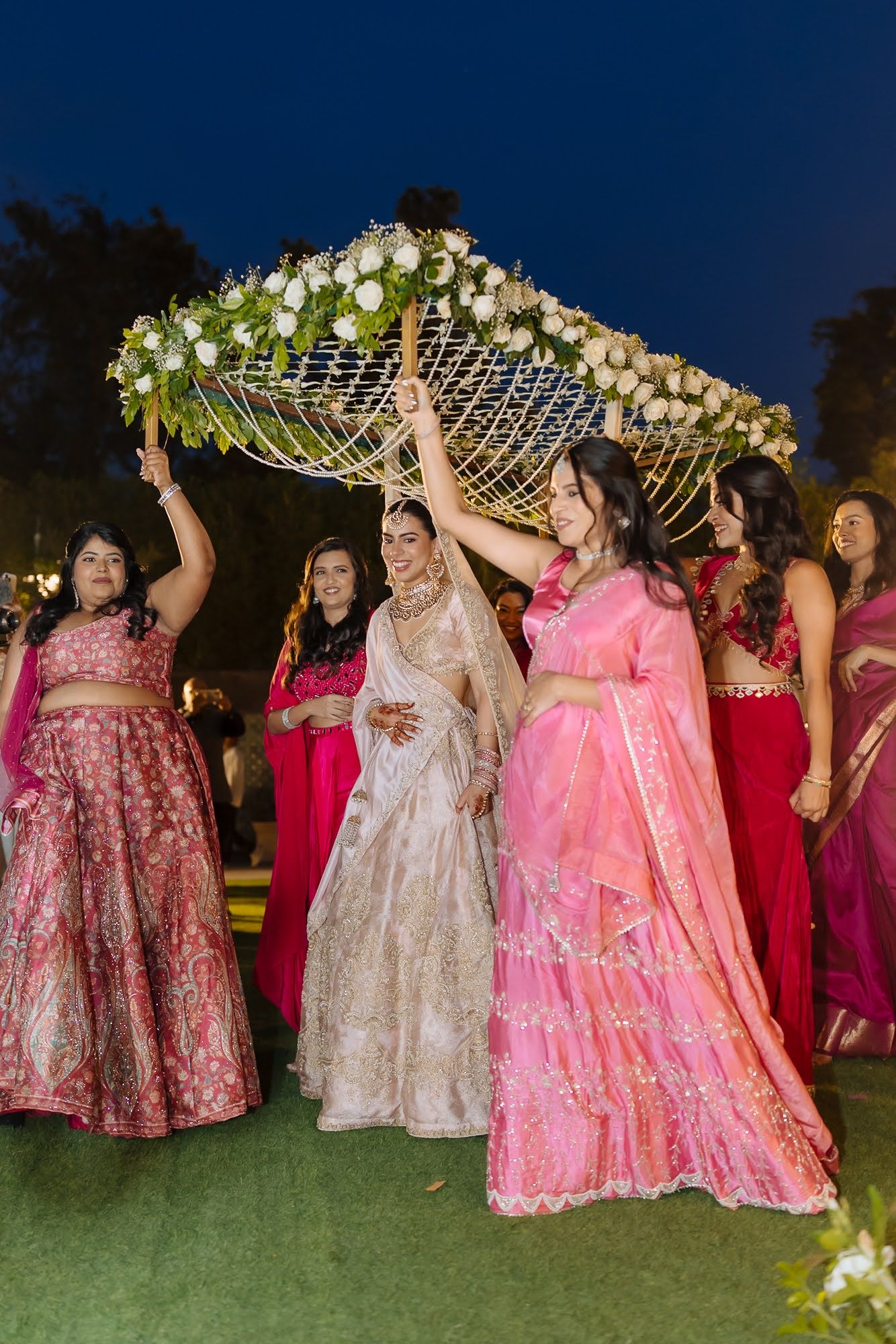 Pastel pink bride Leah making her Indian wedding entrance at Tivoli Chattarpur