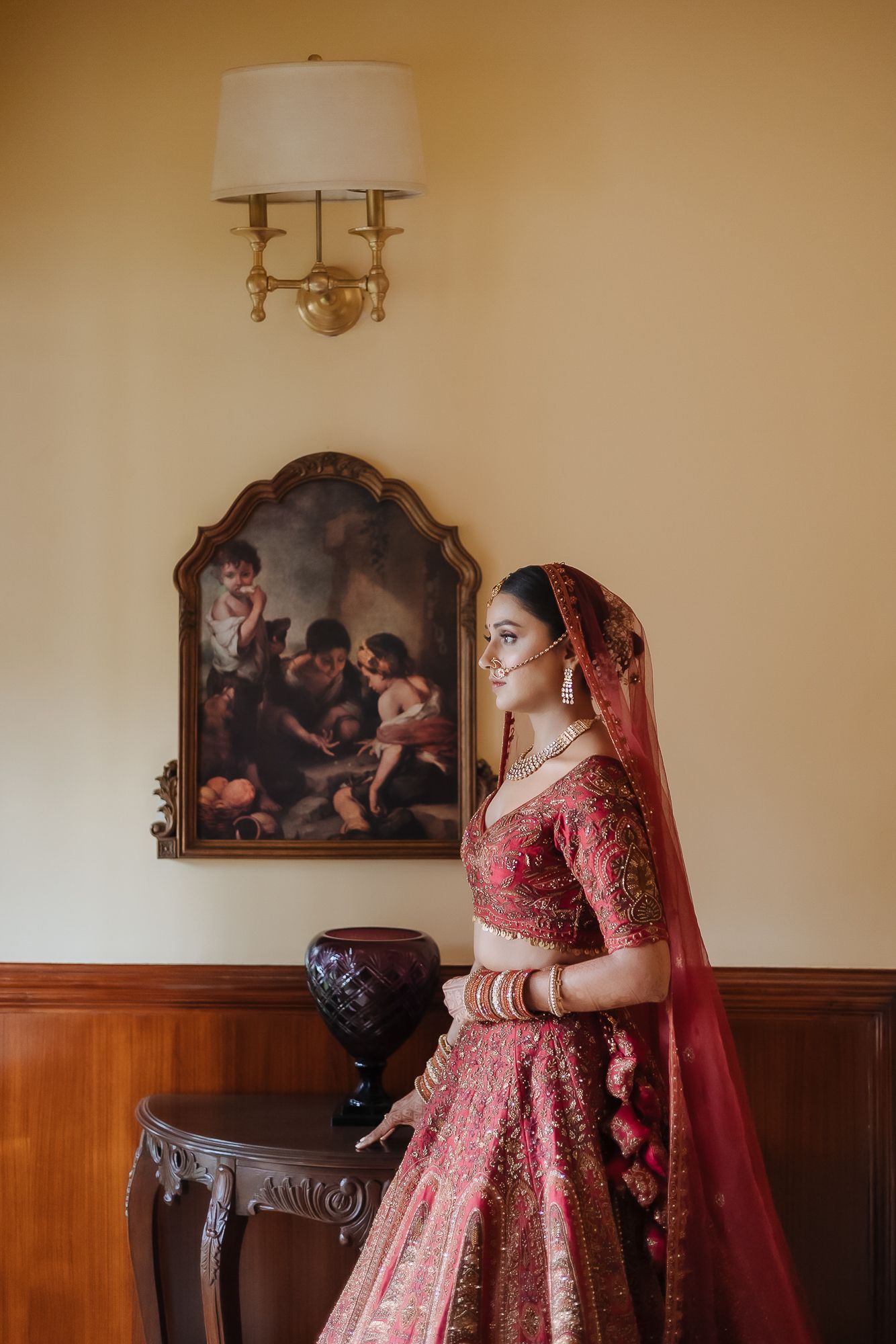 Indian bride in maroon lehenga with fine-art portraits for an intimate wedding of 30 people wedding in the hills at Daleside Manor, Kasauli
