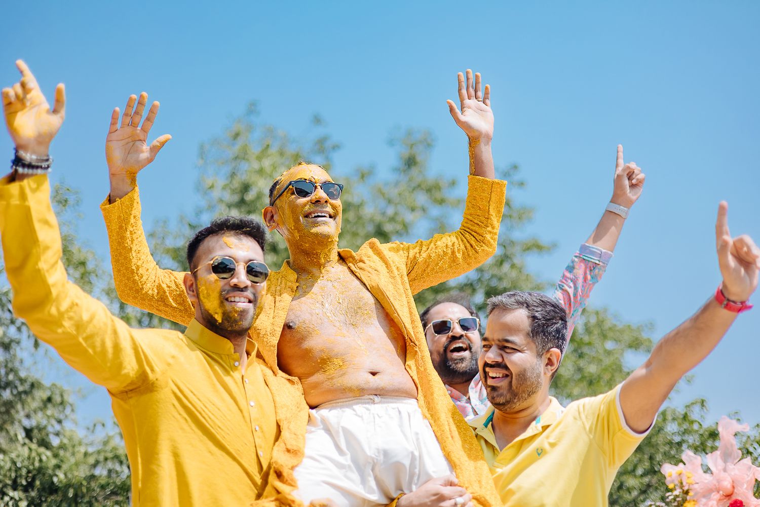 Colorful and candid Haldi moments captured by Fine-art and candid Indian wedding photography and films team Beginnings For You.