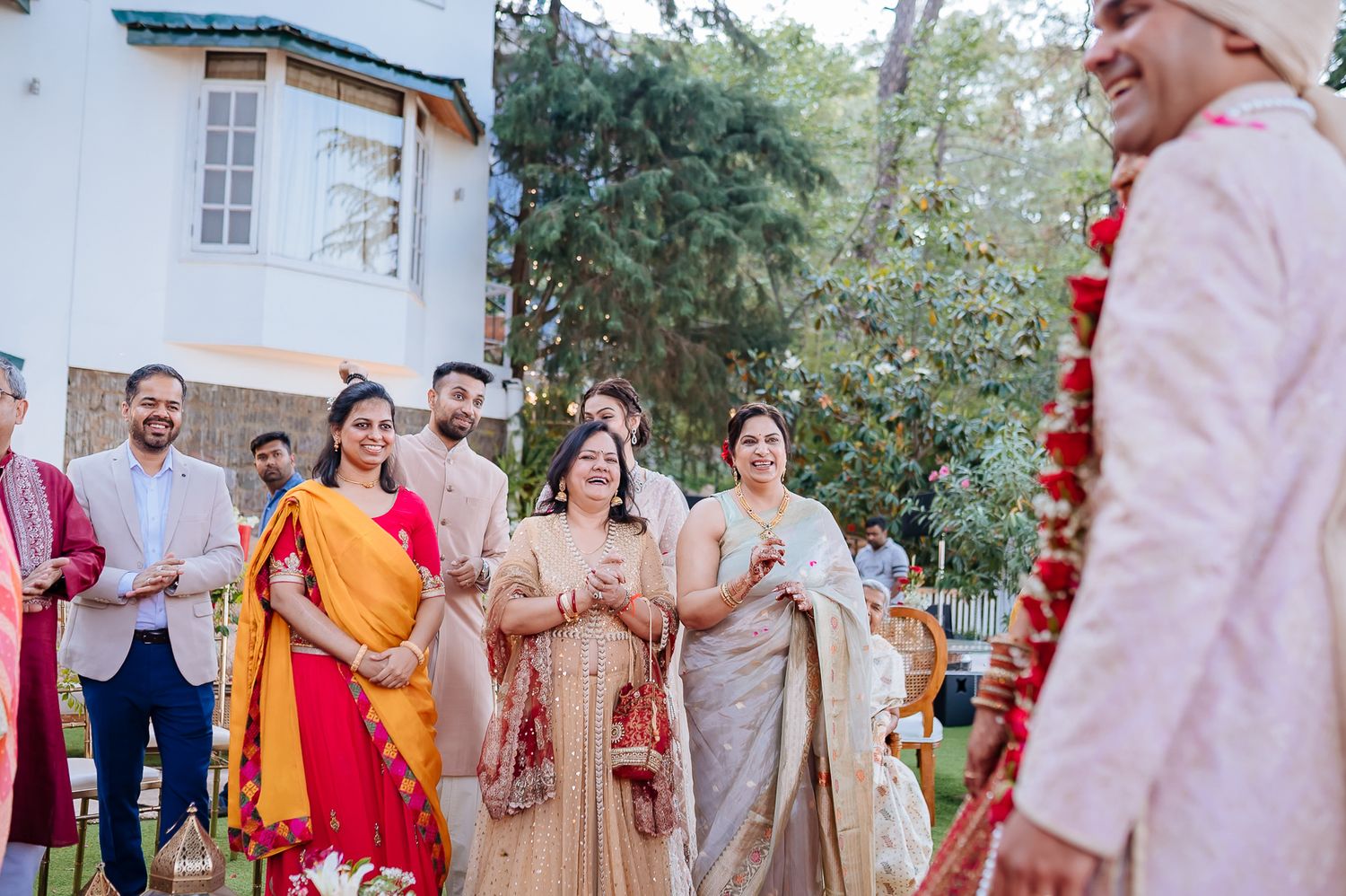 friends and family throwing flowers at bride and groom at an intimate wedding of 30 guests in the hills at Daleside Manor Kasauli