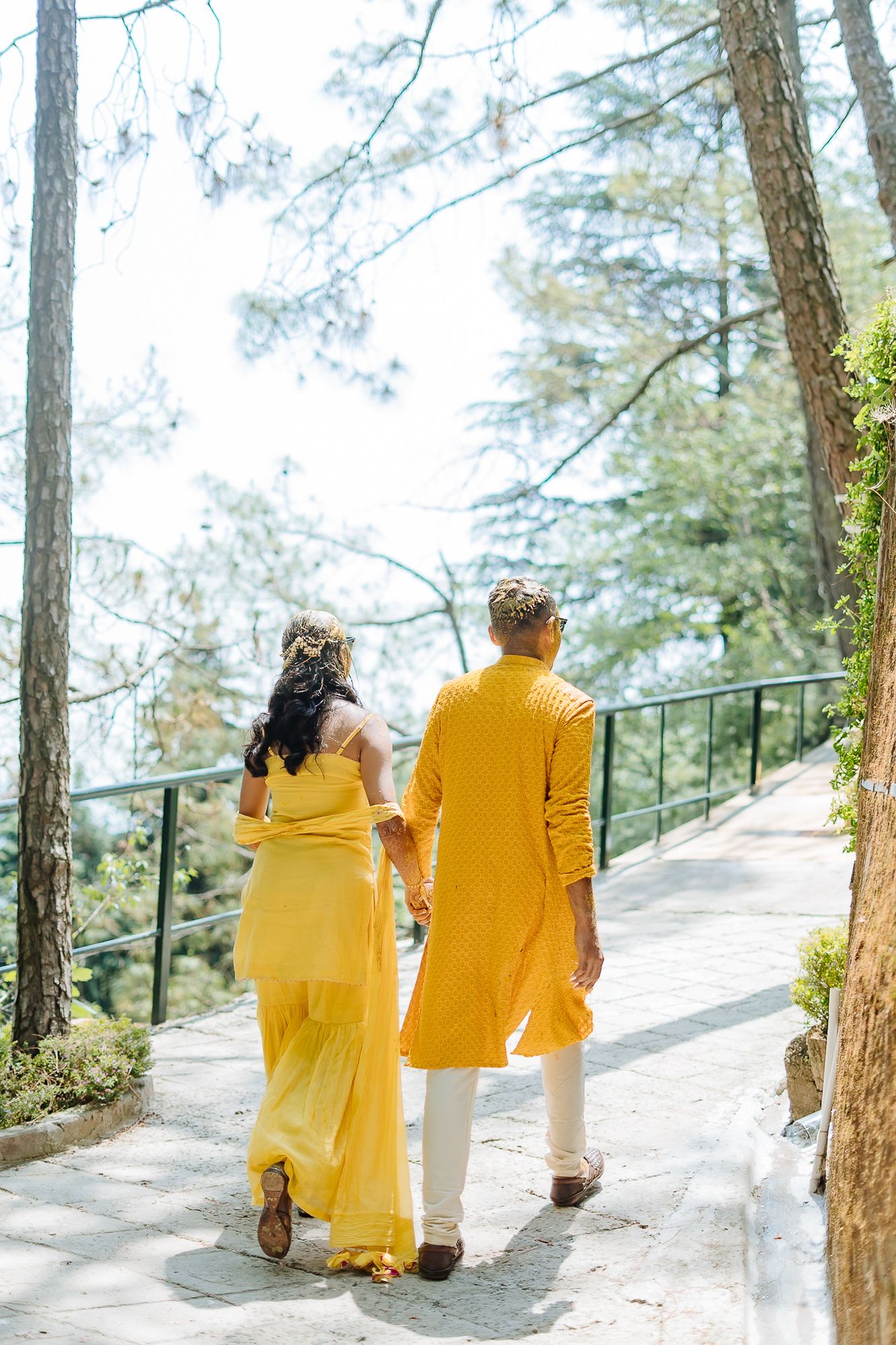 Colorful and candid Haldi couple portraits captured by Fine-art and candid Indian wedding photography and films team Beginnings For You.