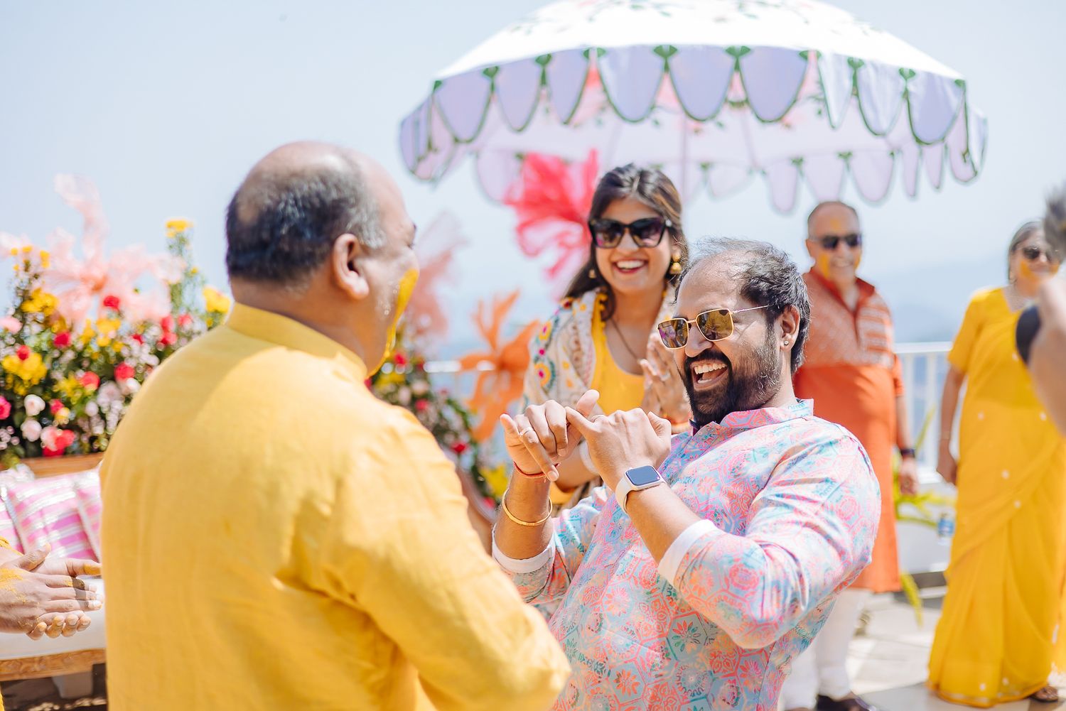 Colorful and candid Haldi moments captured by Fine-art and candid Indian wedding photography and films team Beginnings For You.