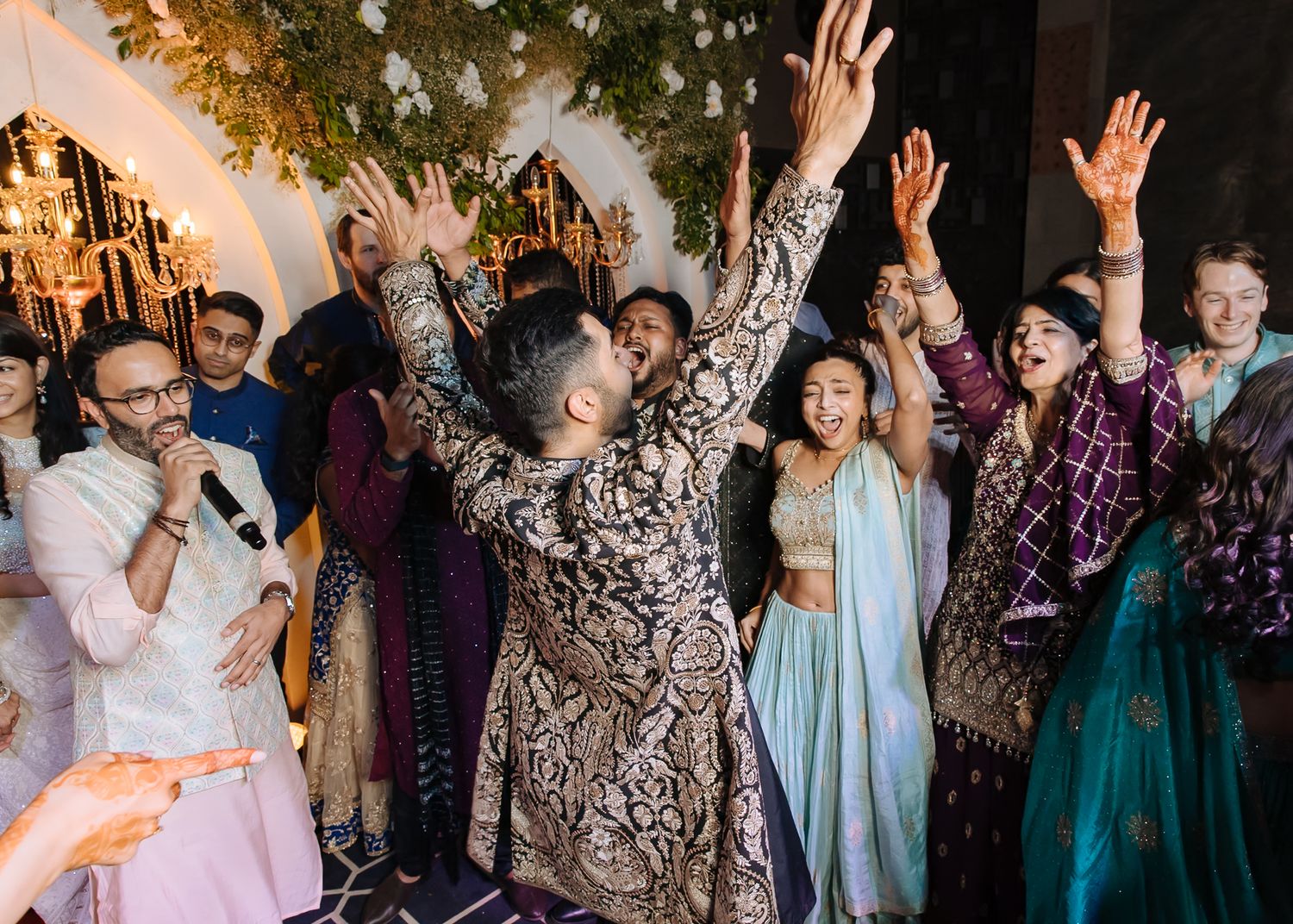 Bride and groom leading an unforgettable dance battle at their wedding celebration at Tivoli Chattarpur