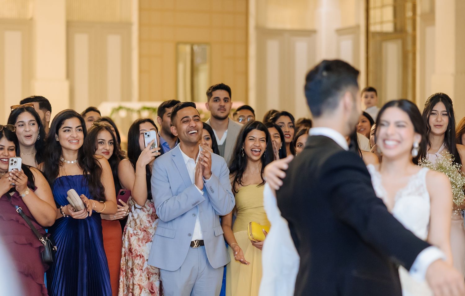 Wedding guests watching Shorye and Leah share their first dance after their christian wedding ceremony at Tivoli Chattarpur