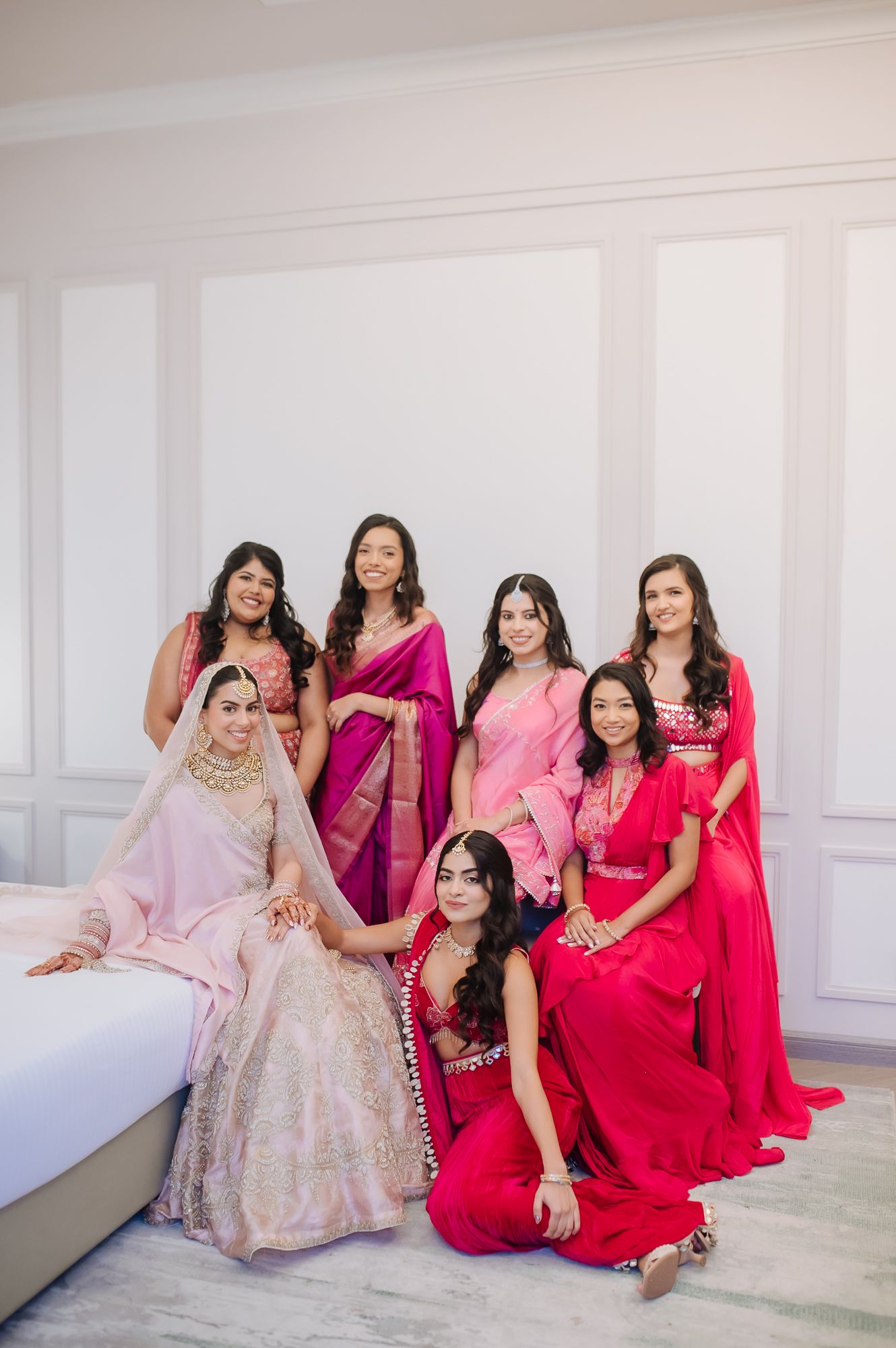 Leah’s radiant bridal portrait with her bridesmaids in shades of pink at Tivoli Chattarpur