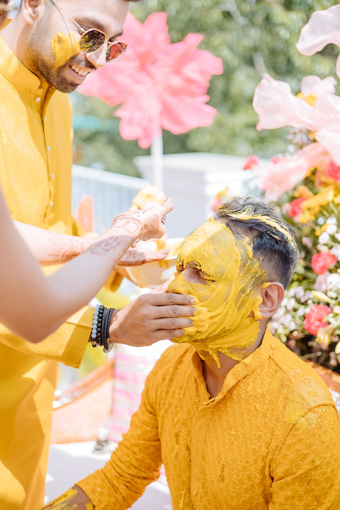 Colorful and candid Haldi moments captured by Fine-art and candid Indian wedding photography and films team Beginnings For You.