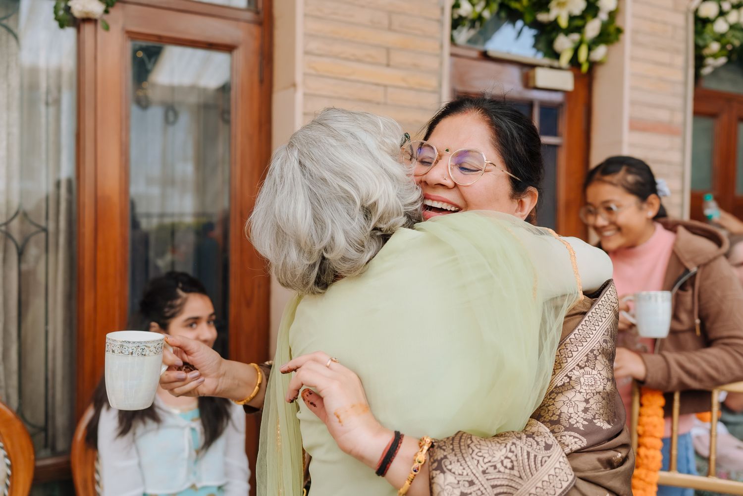 Laughter and candid moments during a luxury intimate Mehendi ceremony