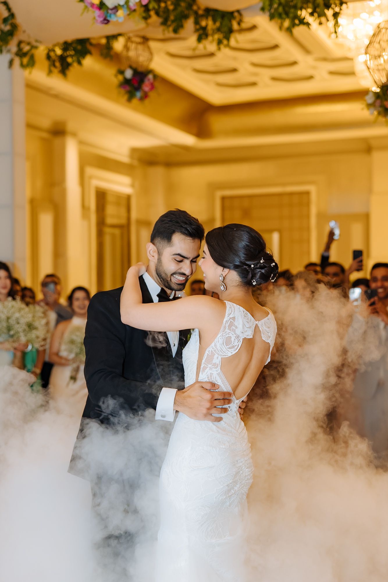 Newlyweds Shorye and Leah enjoying their first dance surrounded by loved ones, after the christian wedding ceremony at Tivoli Chattarpur