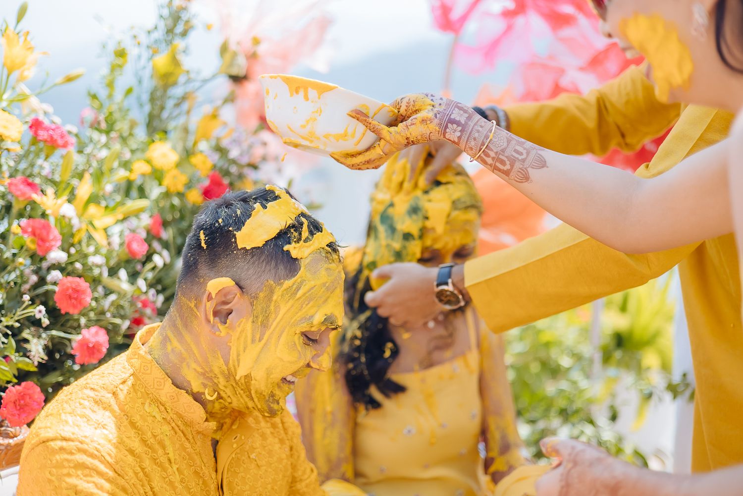 Colorful and Candid Haldi moments captured by Fine-art and candid Indian wedding photography and films team Beginnings For You.