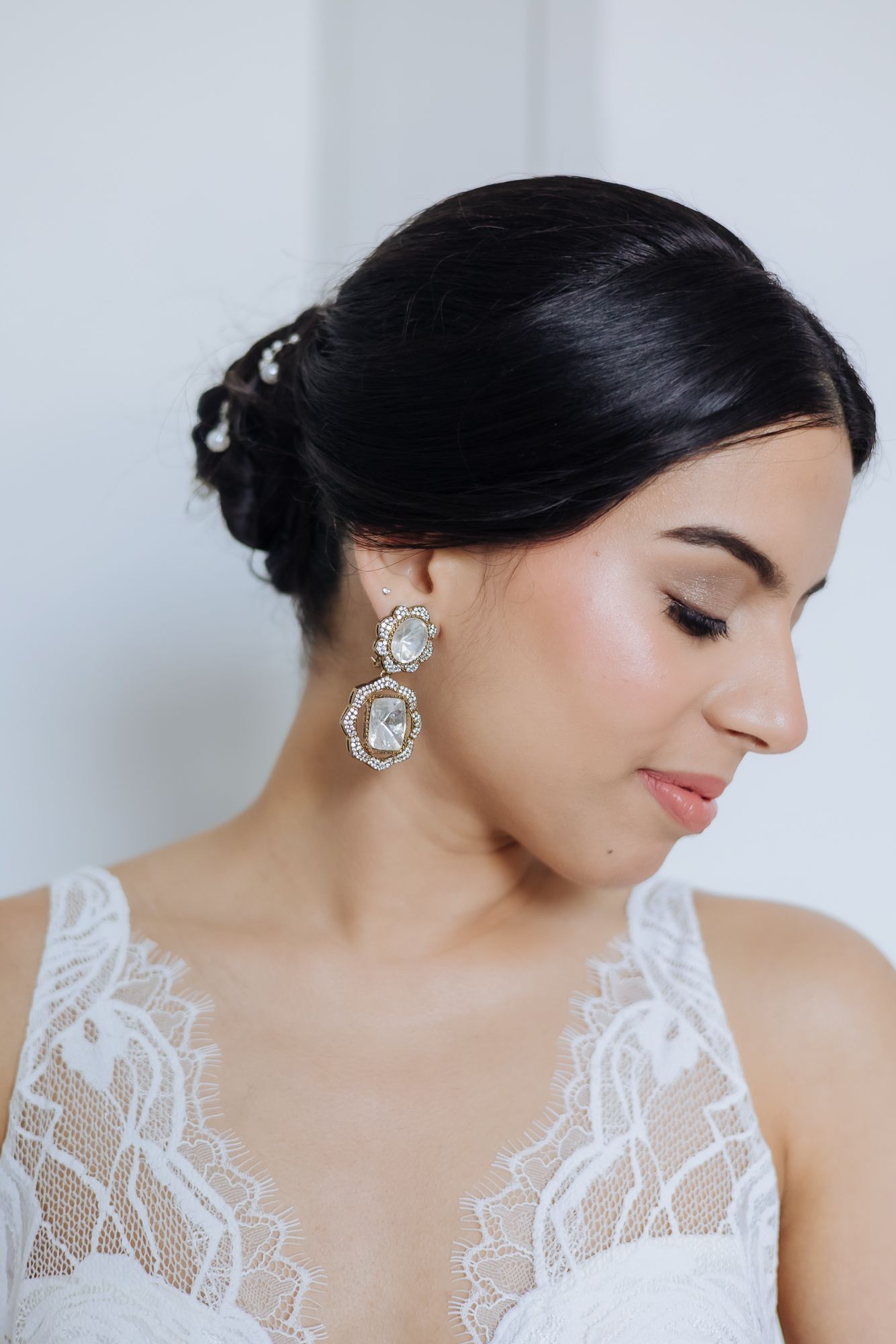 Bride Leah preparing for her Christian wedding in white at Tivoli Chattarpur.