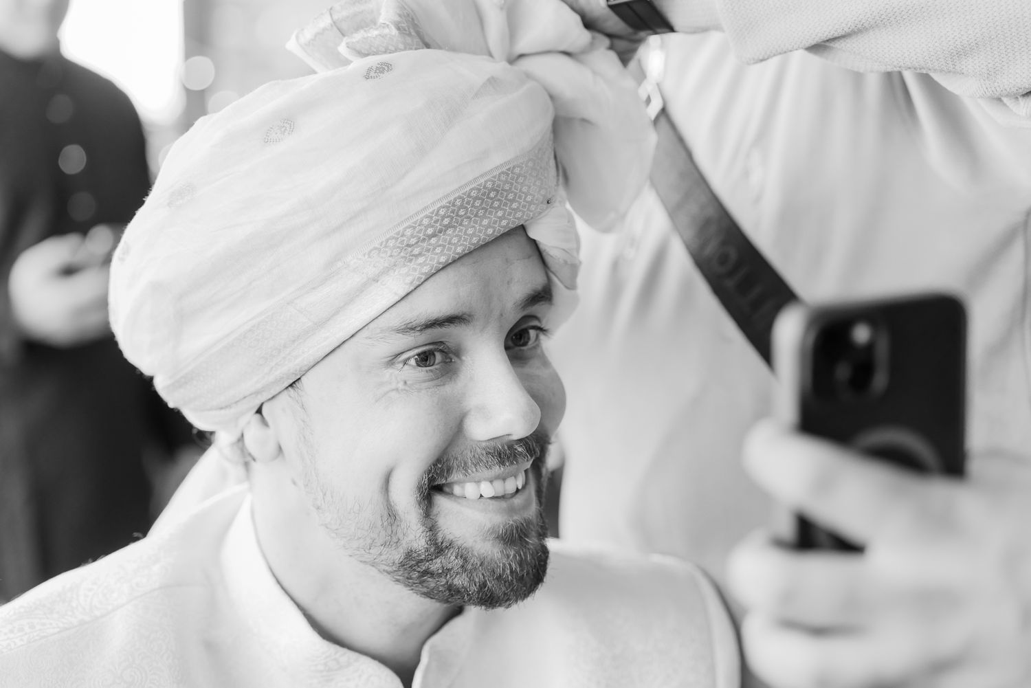 Groom Mats wearing an ivory sherwani before the wedding ceremony for his Indo-Norwegian wedding at Forest Hill, Chandigarh