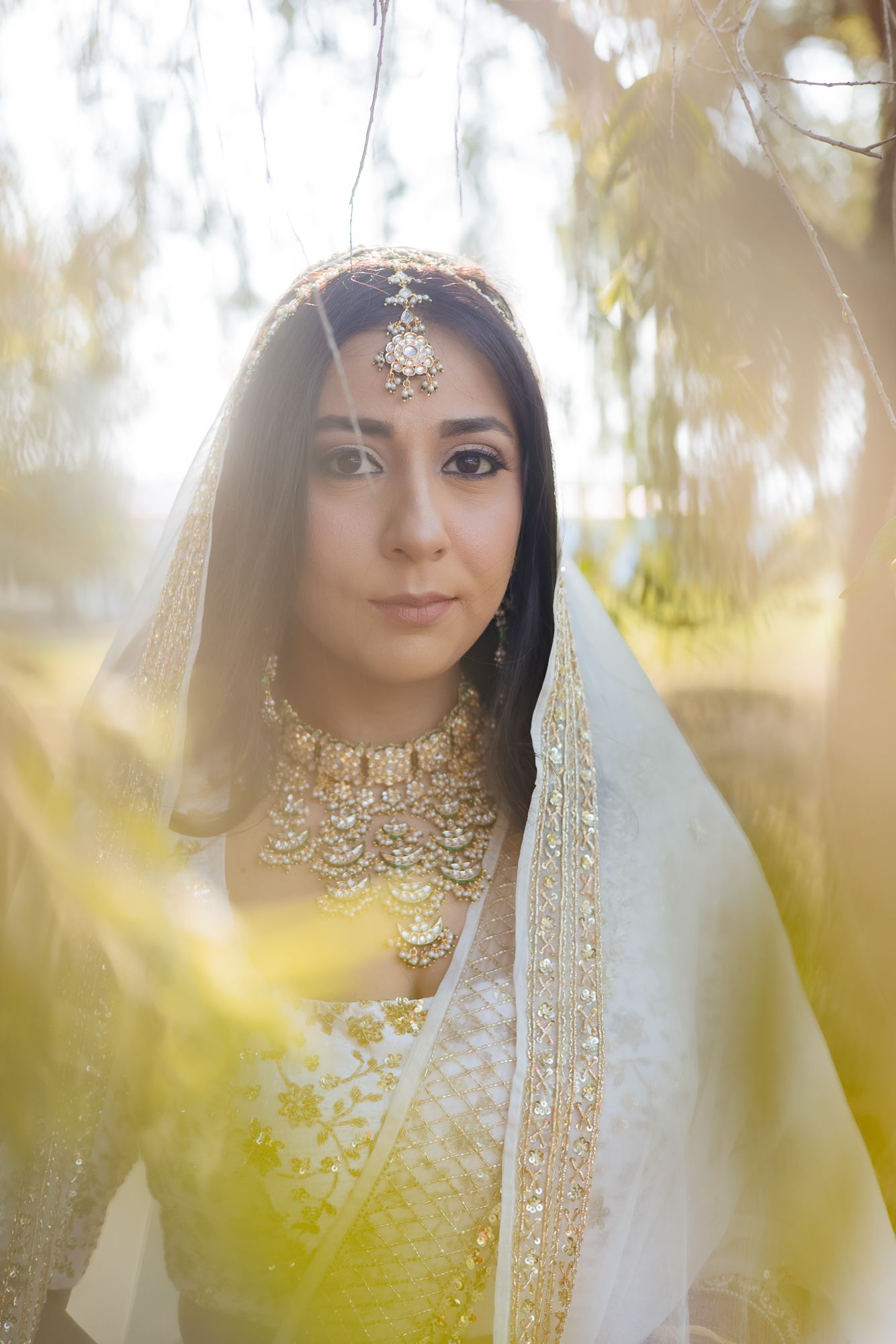 Elegant bridal portrait of Bride Itisha in an ivory lehenga for an intimate Indo-Norwegian wedding in Forest Hill, Chandigarh