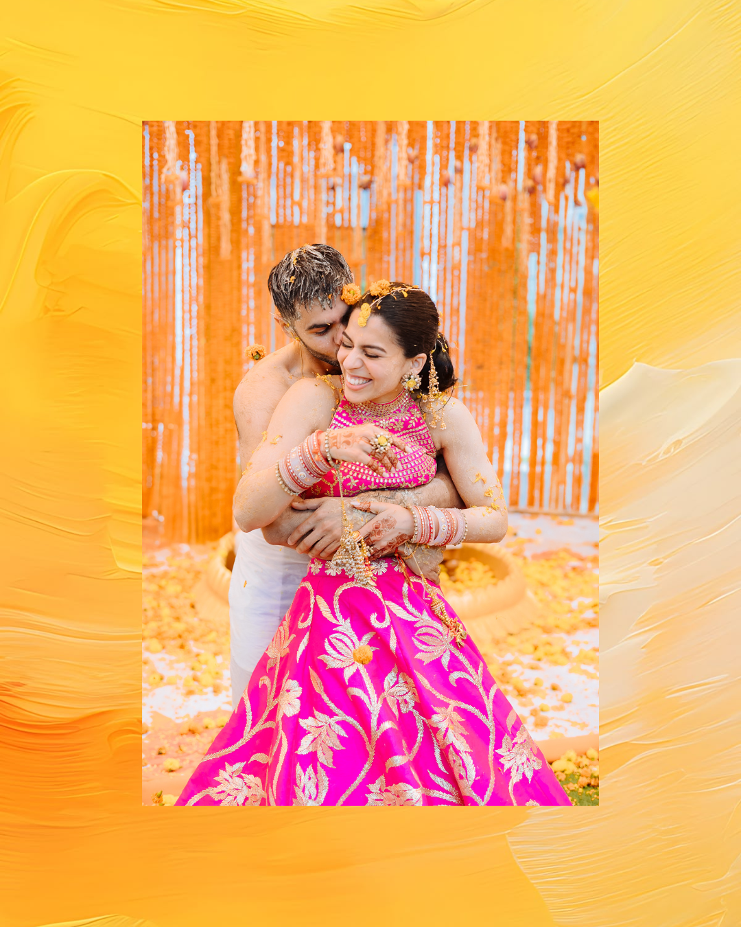 Shorye and Leah covered in haldi during their wedding celebration at Tivoli Chattarpur