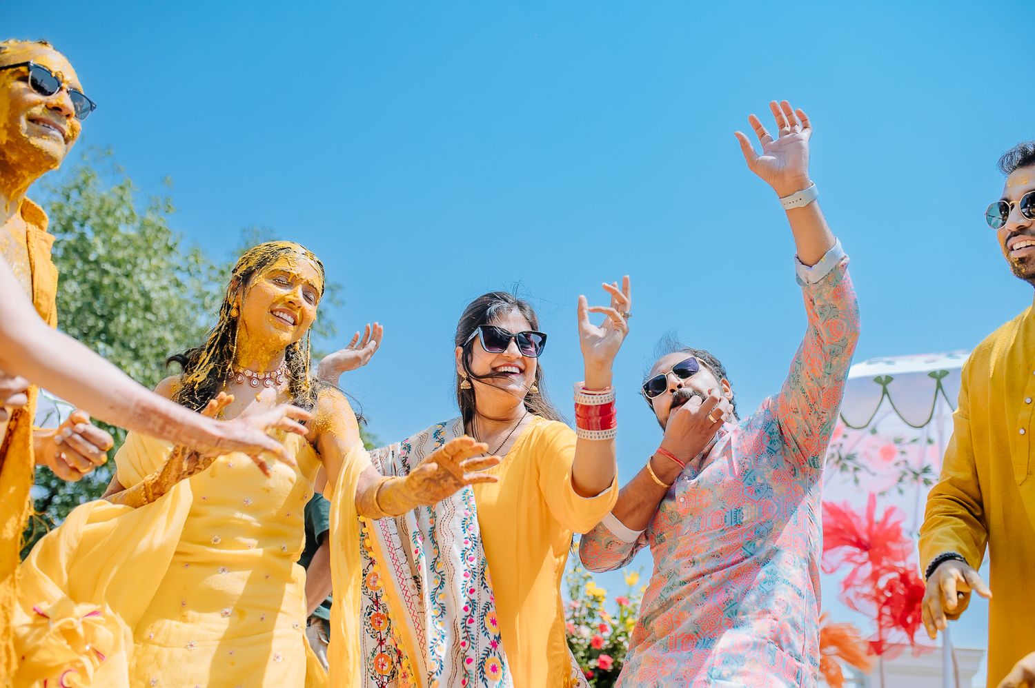 Colorful and candid Haldi moments captured by Fine-art and candid Indian wedding photography and films team Beginnings For You.