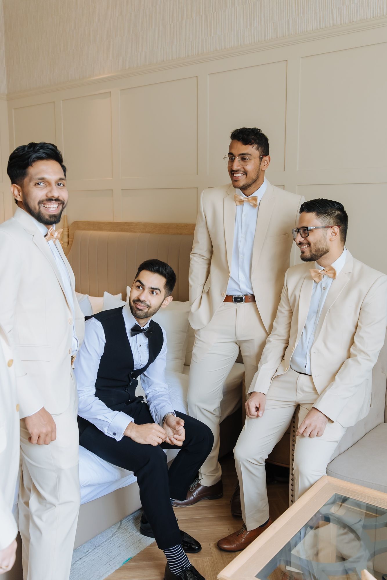 Groom and groomsmen sharing candid moments before the wedding at Tivoli Chattarpur.