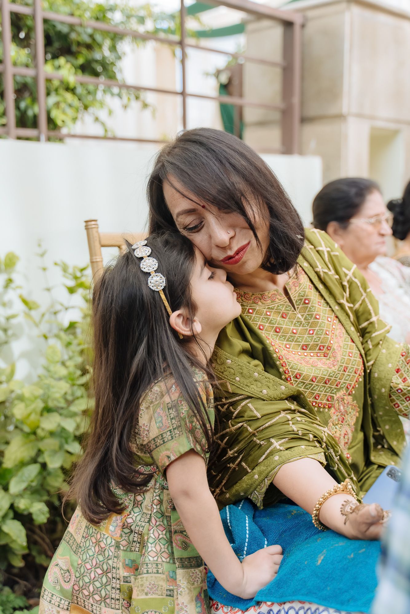 Family dancing together during the Mehendi celebrations at an Intimate home wedding moments before the wedding festivities begin