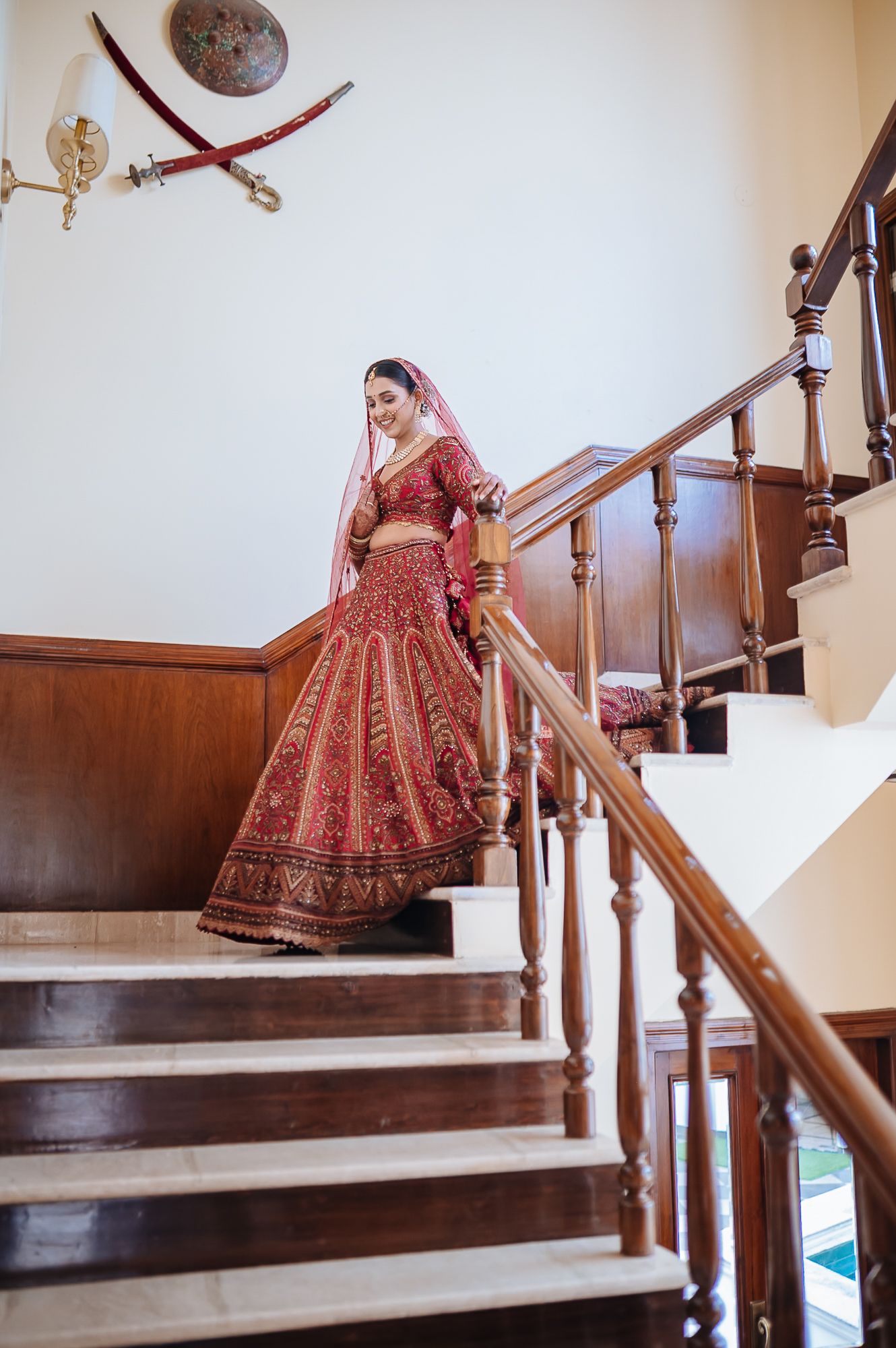 Indian bride in maroon lehenga with fine-art portraits for an intimate wedding of 30 people wedding in the hills at Daleside Manor, Kasauli