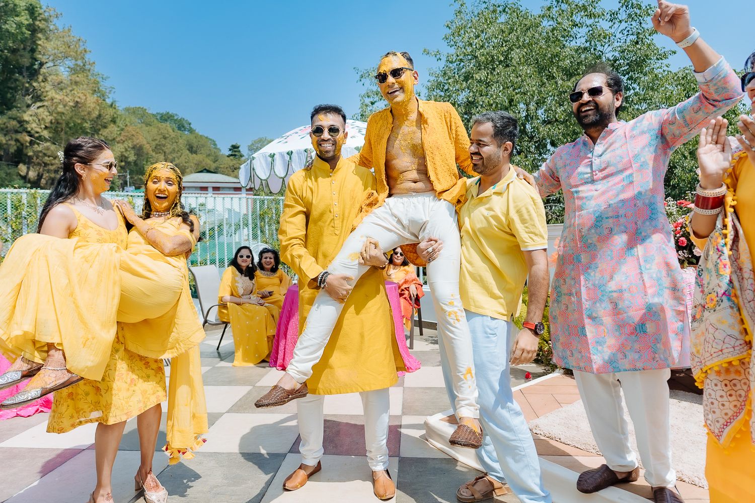 Colorful and candid Haldi moments captured by Fine-art and candid Indian wedding photography and films team Beginnings For You.