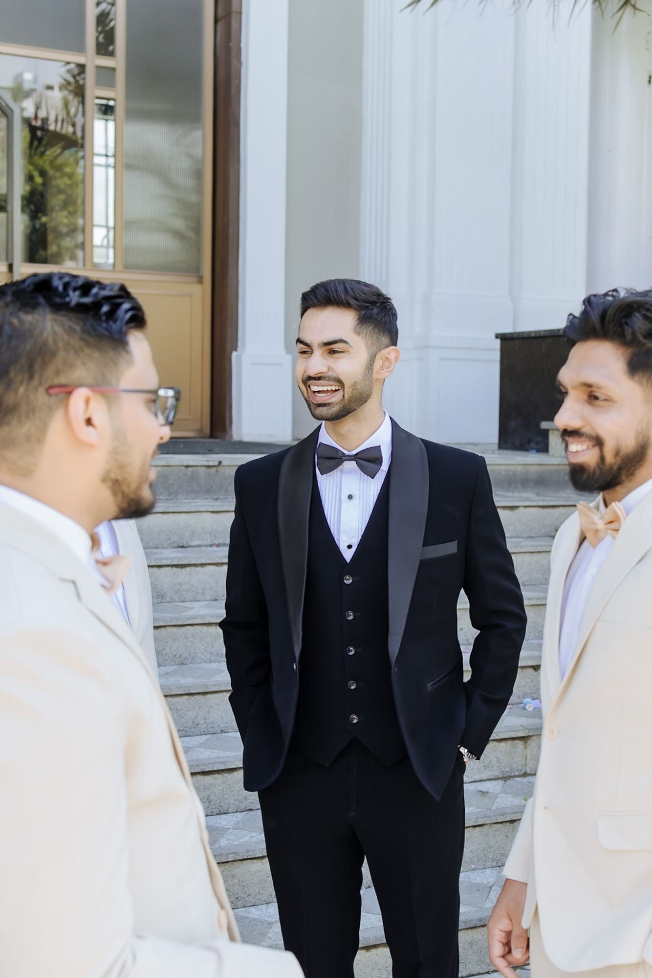 Groomsmen reacting as Shorye gets ready for his wedding at Tivoli Chattarpur.
