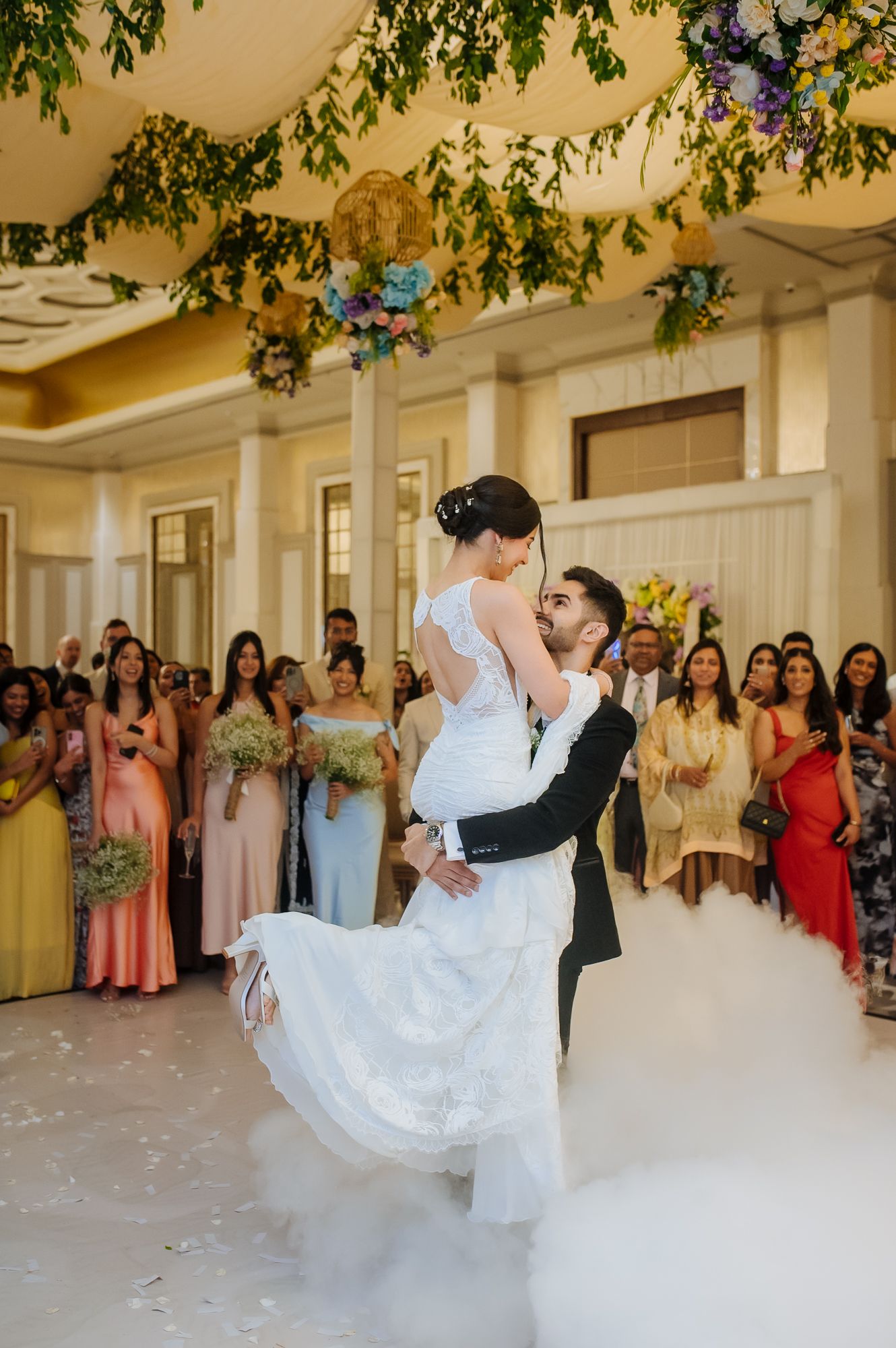 Newlyweds Shorye and Leah enjoying their first dance surrounded by loved ones, after the christian wedding ceremony at Tivoli Chattarpur