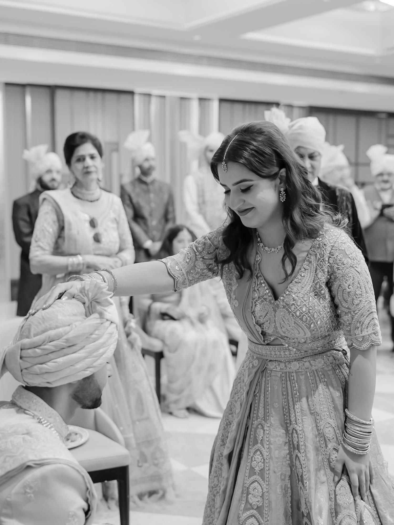Shorye receiving blessings from his family before the Indian wedding at Tivoli Chattarpur