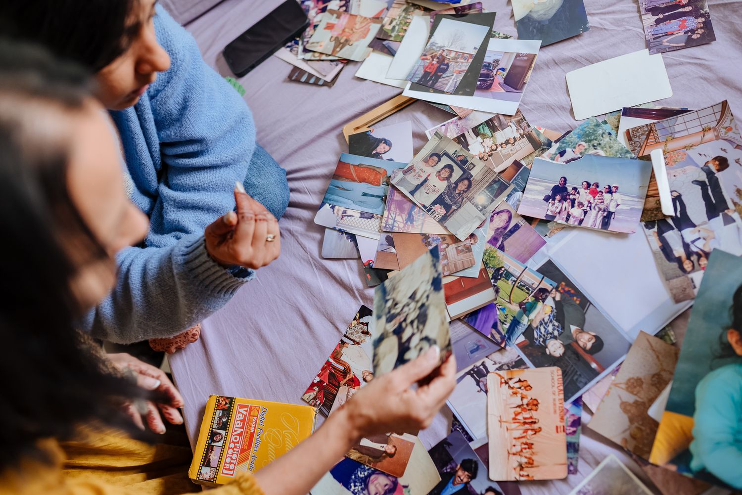 Emotional storytelling wedding photograph of a bride with treasured family memories by Luxury candid wedding photography capturing nostalgia